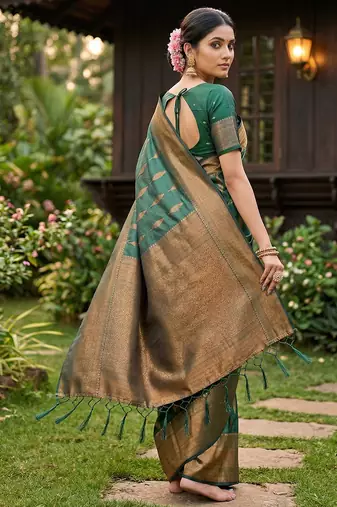 Green colour silk blend woven saree with rich zari border and elegant tassels