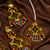Festive multicolor gold tone earrings and tikka set