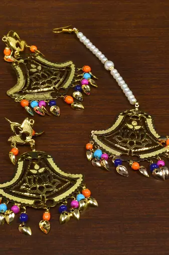 Festive lotus beaded earrings and maang tikka