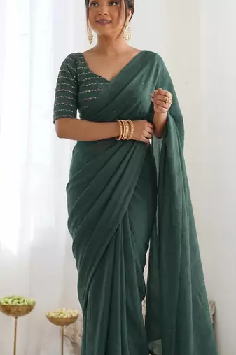  dark bottle green solid saree with embellished blouse
