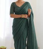 New trendy elegant dark bottle green solid saree with embellished blouse