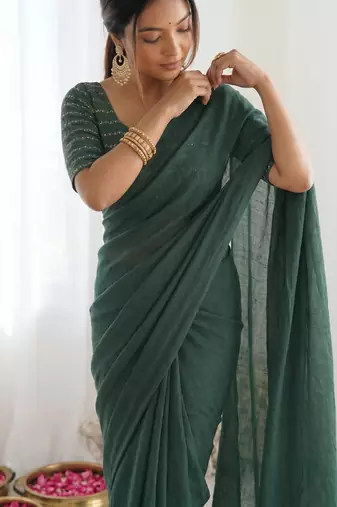  dark bottle green solid saree with embellished blouse