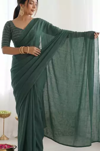  dark bottle green solid saree with embellished blouse