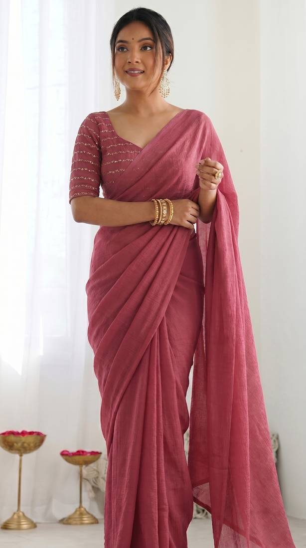 New trendy elegant peach solid saree with embellished blouse
