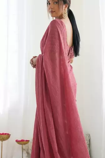 New trendy elegant peach solid saree with embellished blouse