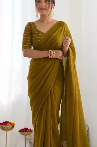 New trendy elegant gold solid saree with embellished blouse