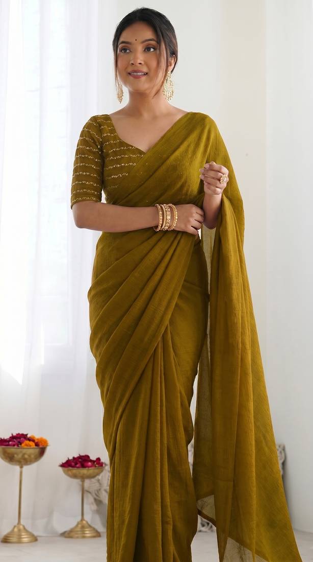New trendy elegant gold solid saree with embellished blouse