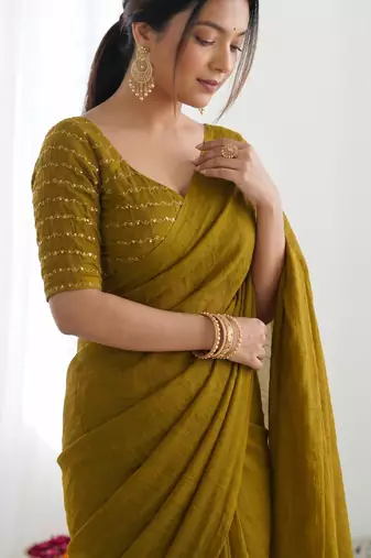 New trendy elegant gold solid saree with embellished blouse