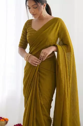 New trendy elegant gold solid saree with embellished blouse