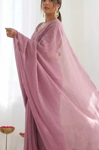 New trendy elegant baby pink solid saree with embellished blouse