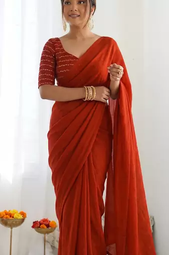 New trendy elegant orange solid saree with embellished blouse