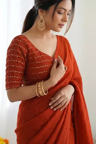 New trendy elegant orange solid saree with embellished blouse