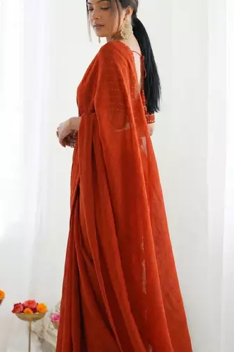 New trendy elegant orange solid saree with embellished blouse