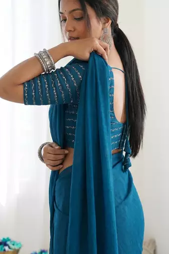 New trendy elegant teal solid saree with embellished blouse