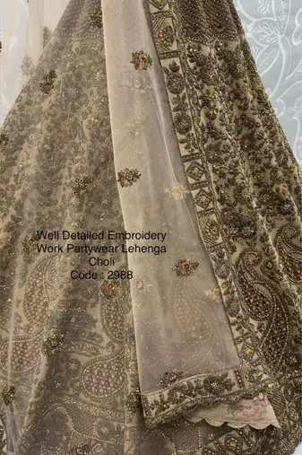 beige net embroidered lehenga choli