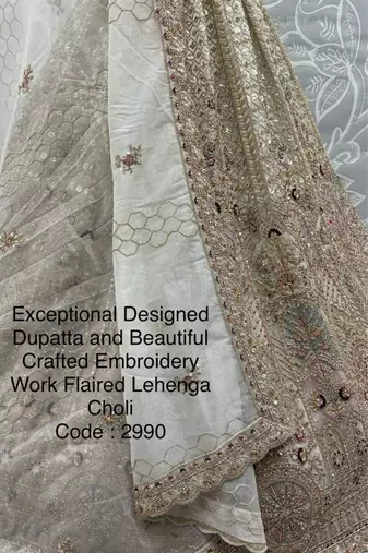 beige net embroidered lehenga choli