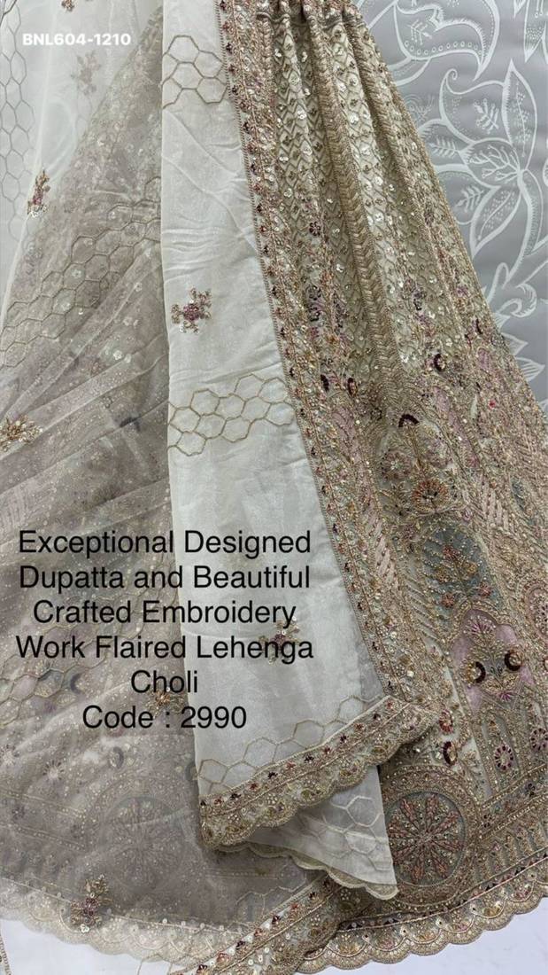 beige net embroidered lehenga choli