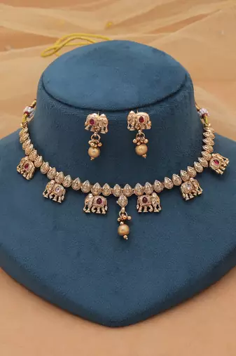 Rani color designer matte gold kundan set