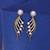 White color american diamond earrings