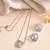 Elegant interlocked heart design with fine stone detailing