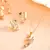 Elegant gold-tone crystal curve pendant/chain set for women