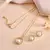 Gold-tone pearl halo pendant chain set with crystal detailing for women