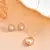 Gold-tone pearl halo pendant chain set with crystal detailing for women