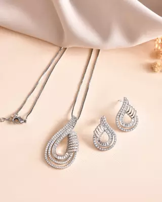 Luxury teardrop diamond pendant  set in silver finish with matching earrings 1