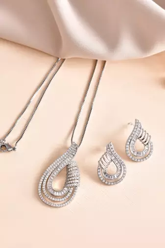 Luxury teardrop diamond pendant  set in silver finish with matching earrings