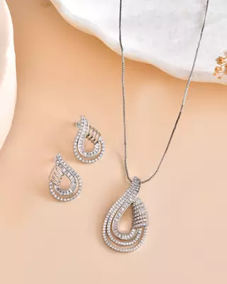 Luxury teardrop diamond pendant  set in silver finish with matching earrings 2