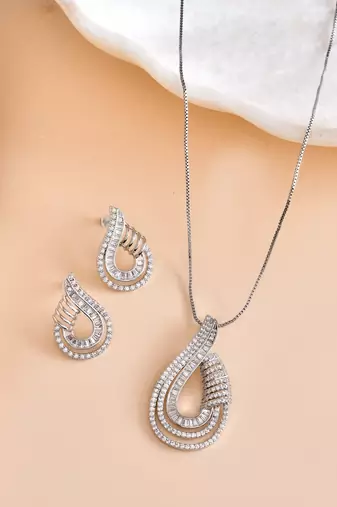 Luxury teardrop diamond pendant  set in silver finish with matching earrings