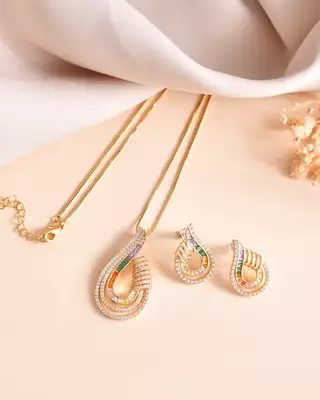 Luxury teardrop diamond pendant  set in gold finish with matching earrings 1