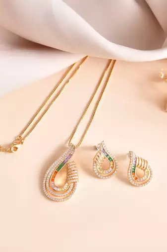 Luxury teardrop diamond pendant  set in gold finish with matching earrings