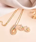 Luxury teardrop diamond pendant  set in gold finish with matching earrings