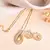 Luxury teardrop diamond pendant  set in gold finish with matching earrings