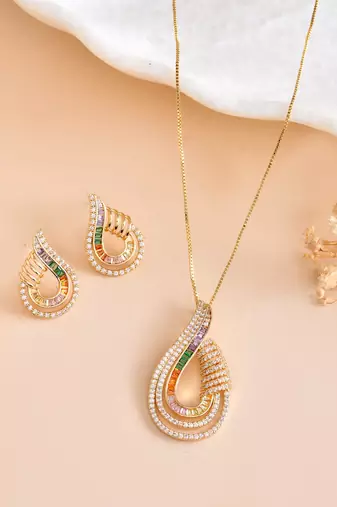 Luxury teardrop diamond pendant  set in gold finish with matching earrings