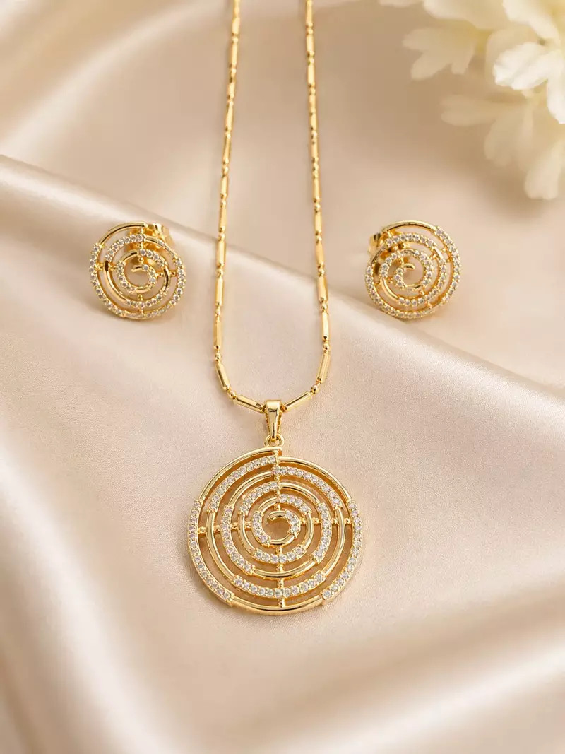 Golden spiral stone pendan with matching earrings for women