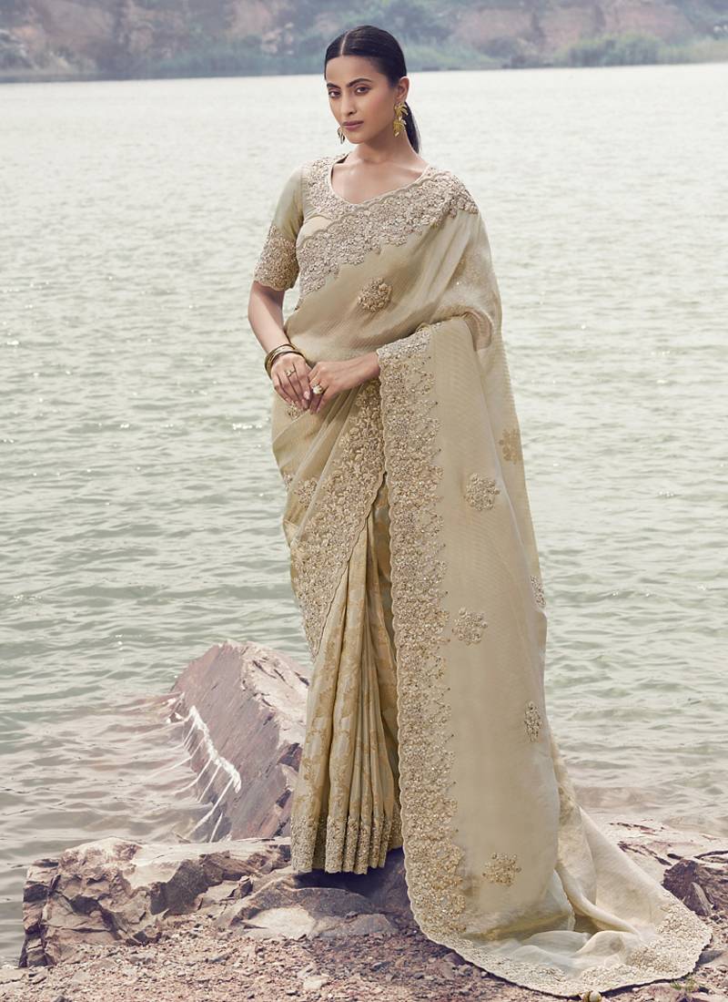 Beige tissue silk with jaquard with designer blouse wedding wear saree