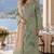 Green silk semi stitched suit with embroidery & sequence work
