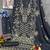 Grey faux georgette semi stitched suit with embroidery work