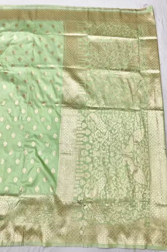 Light green zari woven silk traditional saree with blouse piece