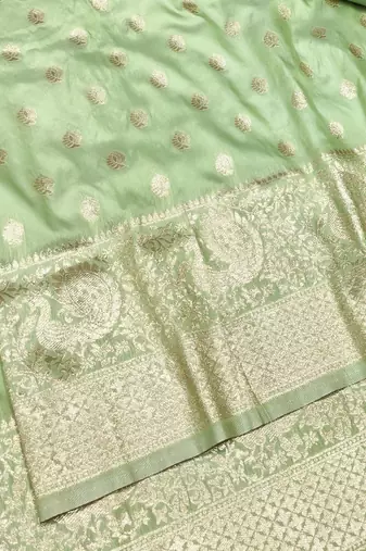 Light green zari woven silk traditional saree with blouse piece