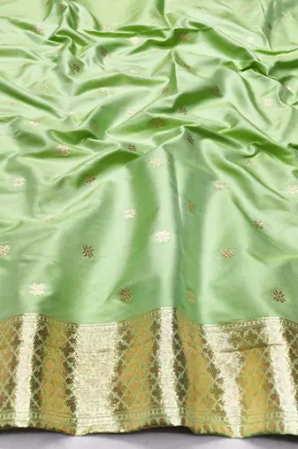 Light green zari woven silk traditional saree with blouse piece