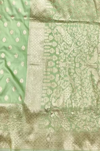 Light green zari woven silk traditional saree with blouse piece