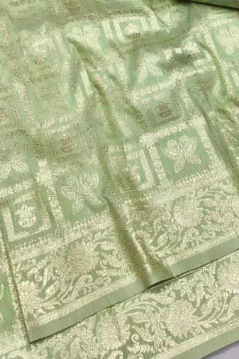 Light green zari woven silk traditional saree with blouse piece