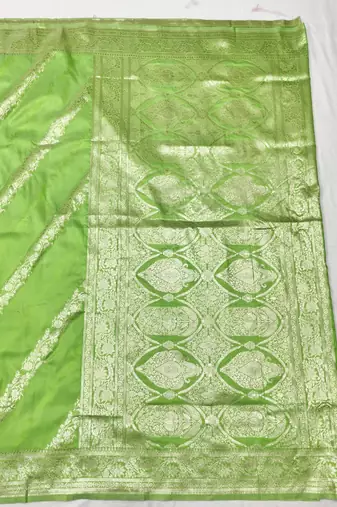 Light green zari woven silk traditional saree with blouse piece