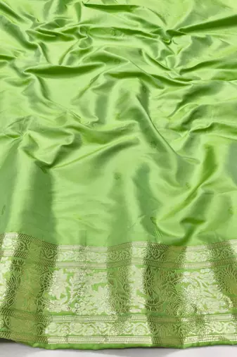 Light green zari woven silk traditional saree with blouse piece