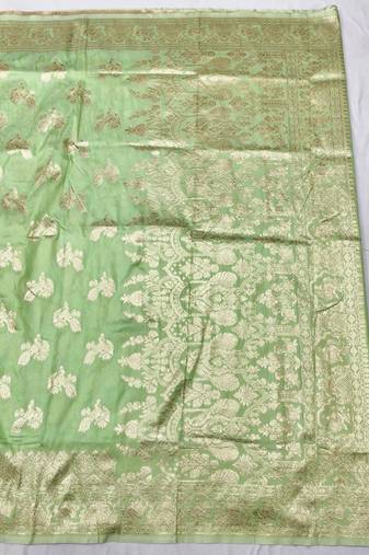 Light green zari woven banarasi silk traditional saree with blouse piece
