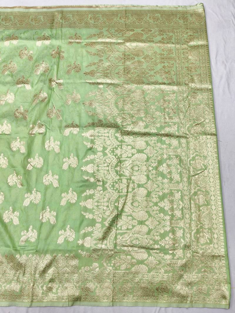 Light green zari woven banarasi silk traditional saree with blouse piece