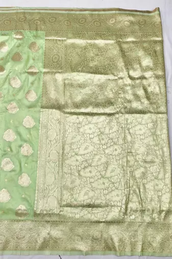 Light green zari woven banarasi silk traditional saree with blouse piece